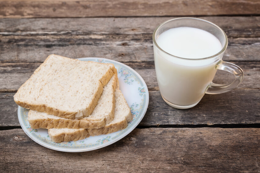 whole grain bread wooden background