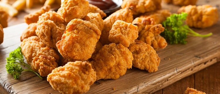 Filés de Coxa e Sobrecoxa de Frango Empanados